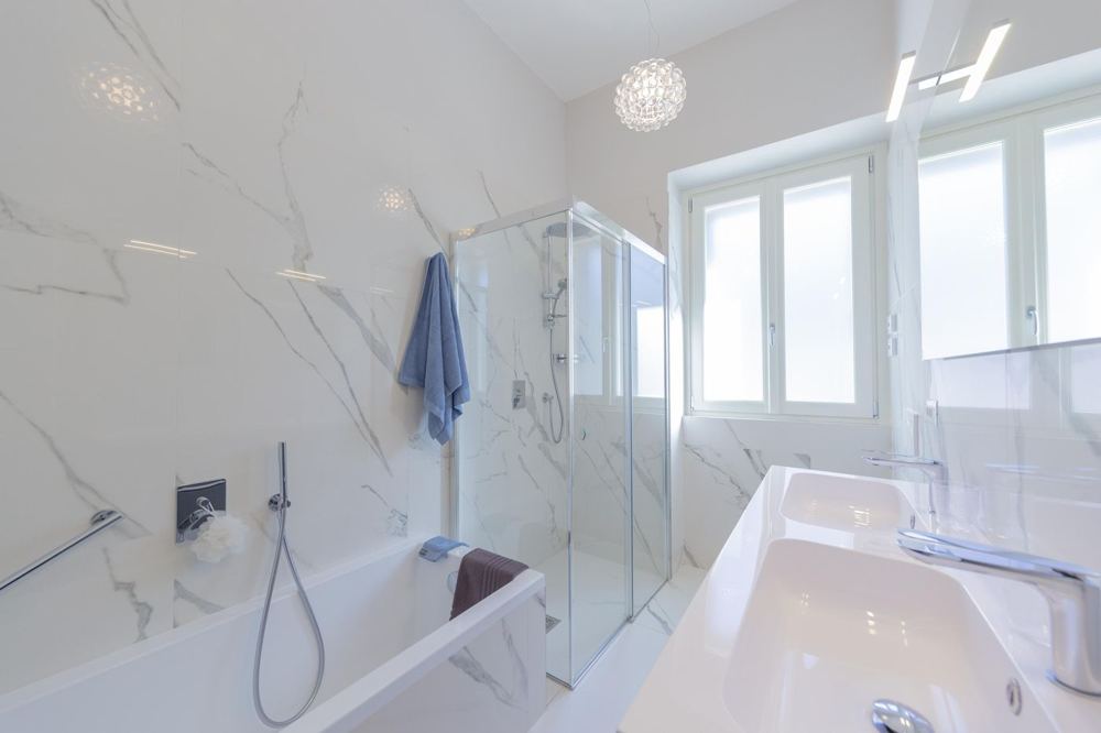 Marble bathroom with bathtub, shower and double basin