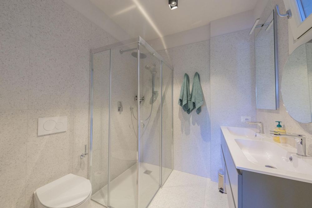 Shower room with terrazzo tiles and double basin